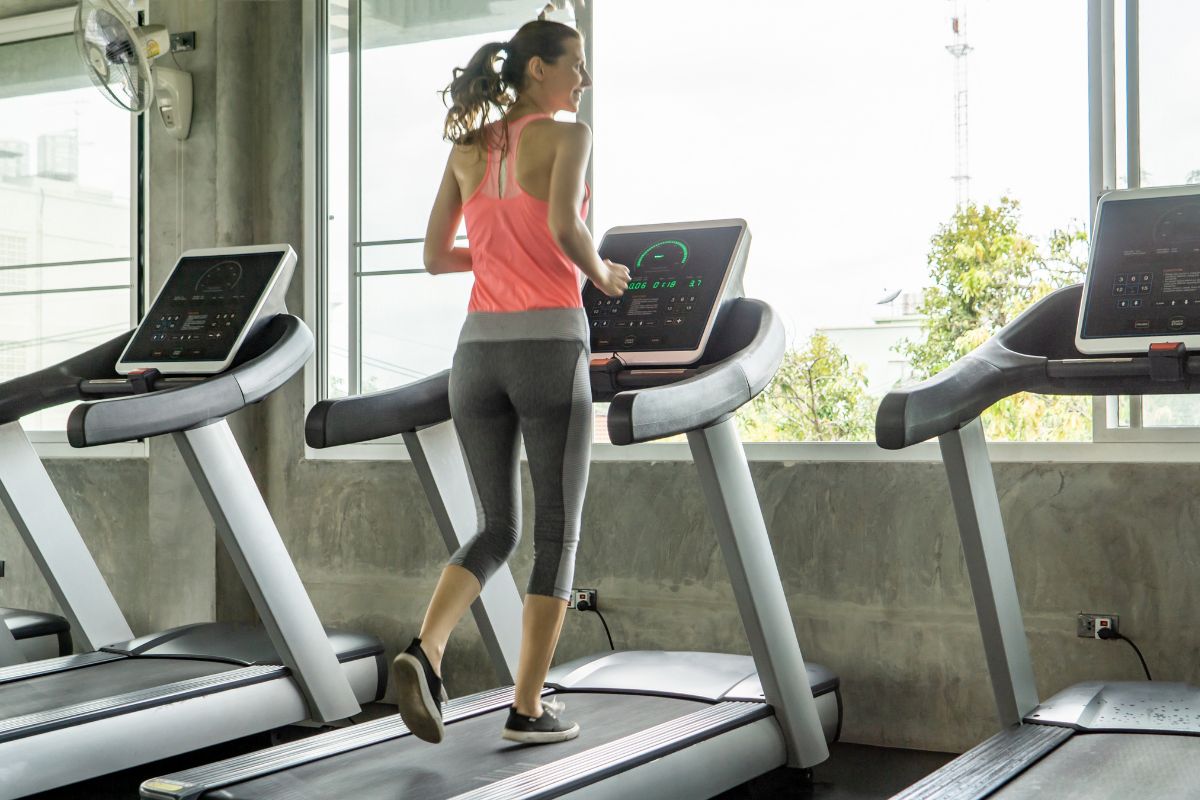 Person starting a beginner treadmill workout with proper form